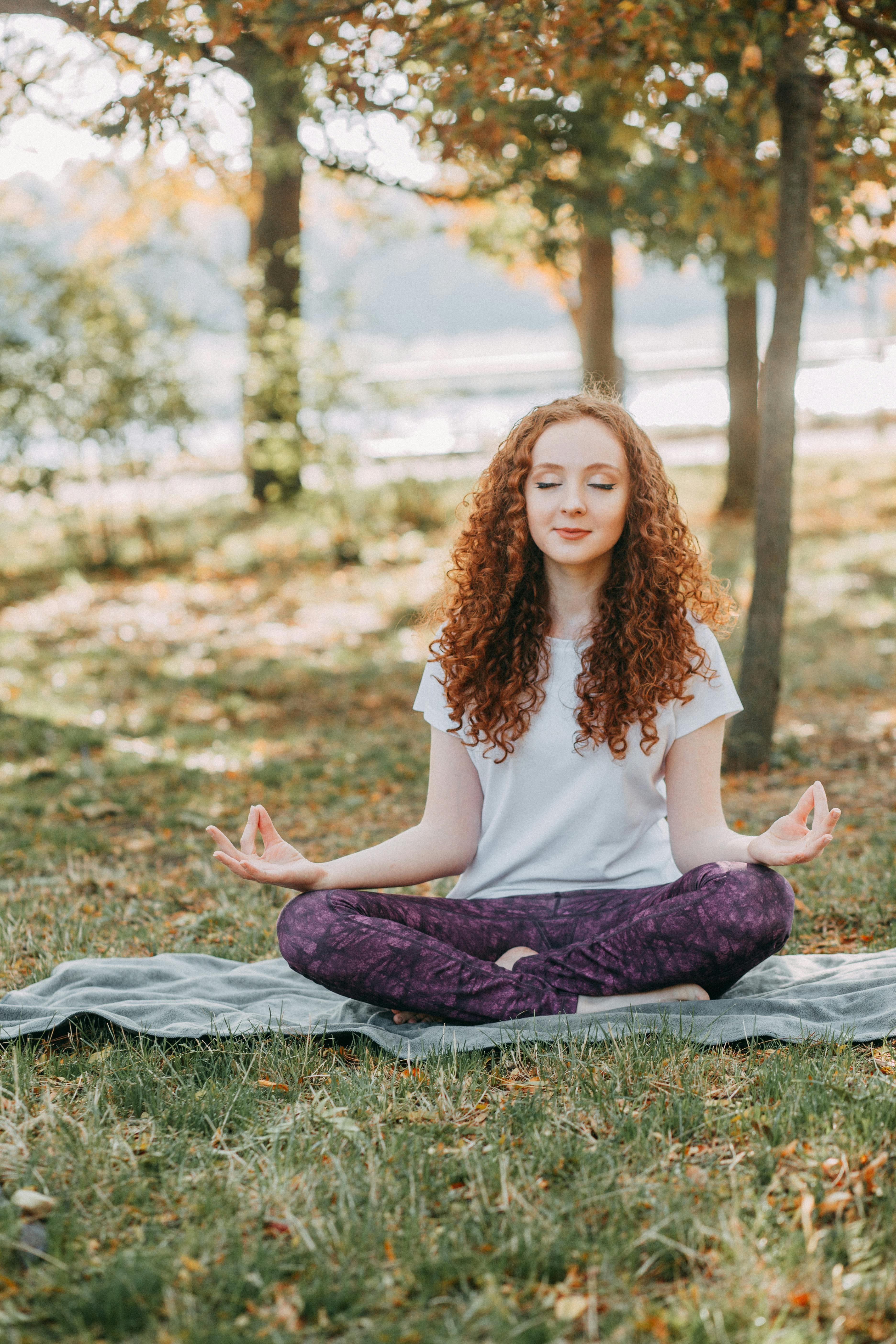 Woman meditating in a peaceful setting